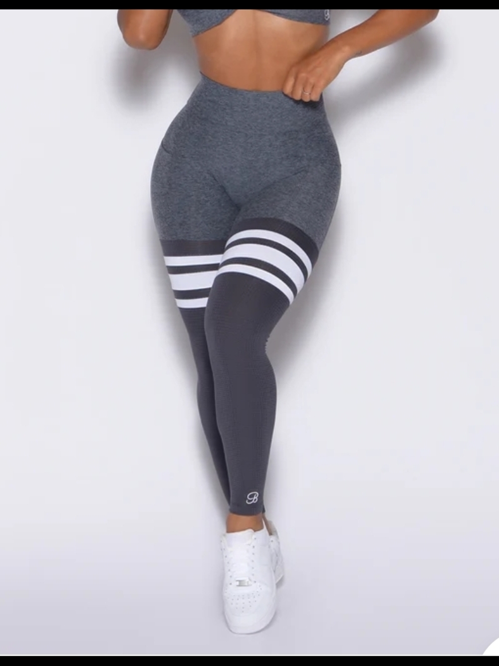 Bombshell Sportswear Shadow Gray Scrunch Thigh-High Leggings with White Stripes.